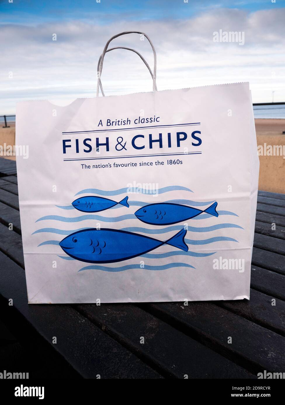 Eco friendly paper Take away Fish and Chips carrier bag on a