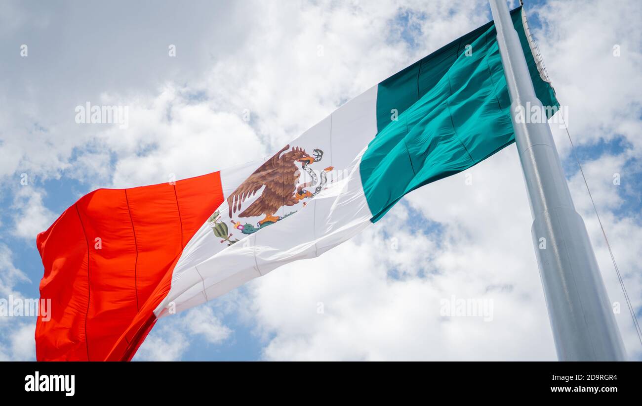 Low Angle View of the Mexican Flag Waving in the Wind Stock Photo