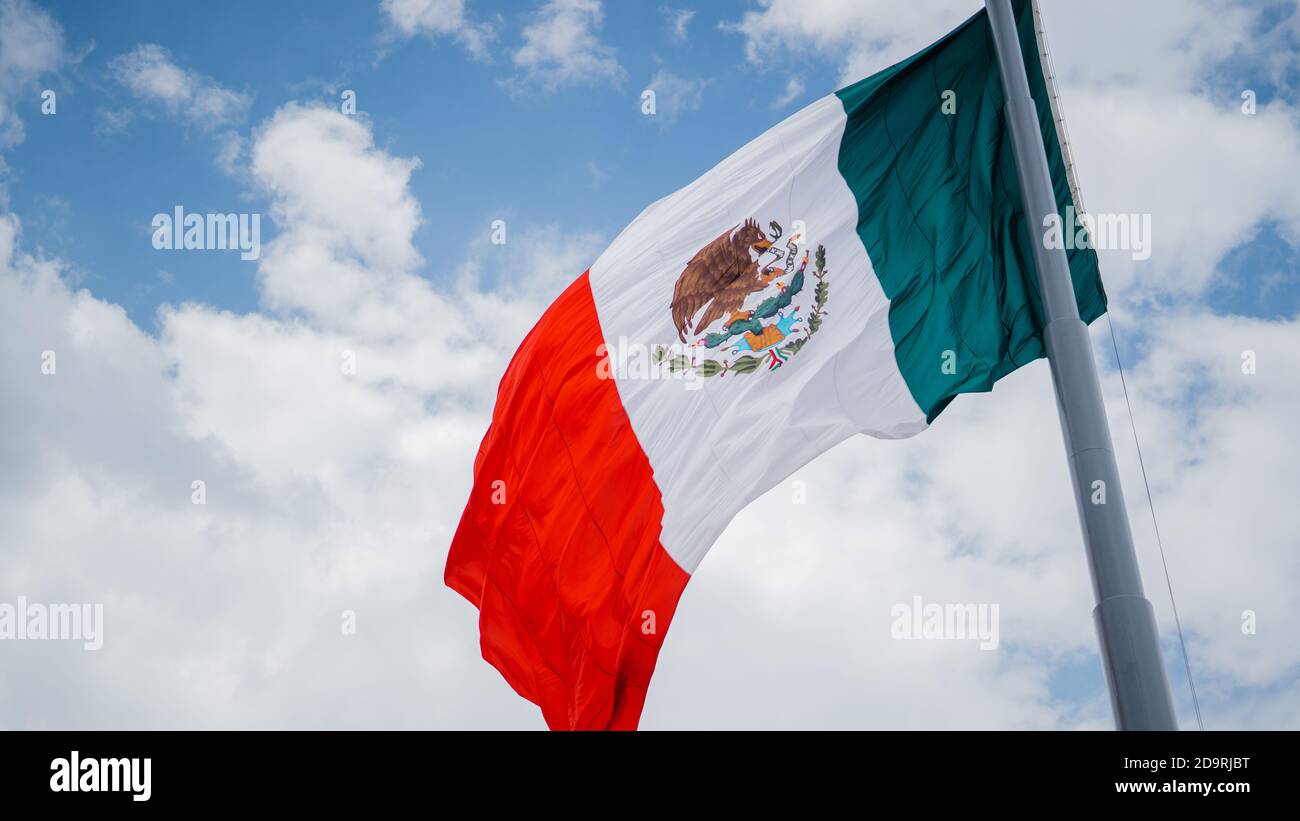 Mexican Flag Bended Because of the Wind Stock Photo