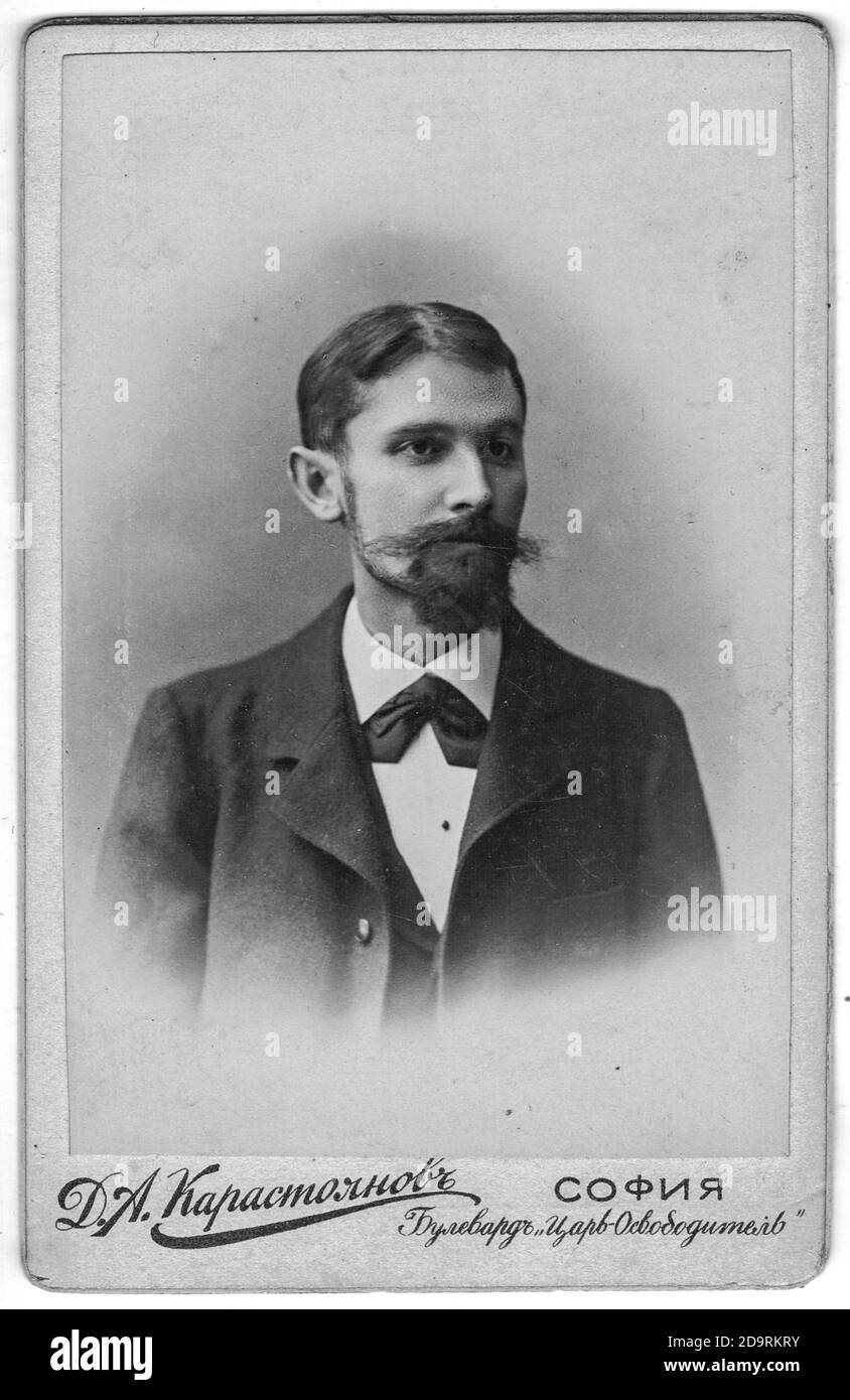 SOFIA, BULGARIA - CIRCA 1910: Vintage cabinet card shows portrait of the midle-aged man with moustache, full beard. Photo was taken in a photo studio. Stock Photo