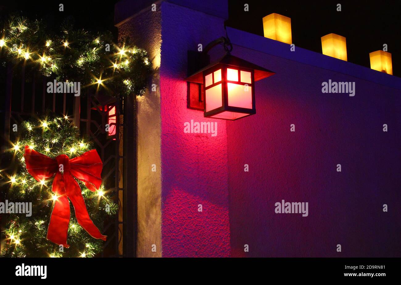 Lighted front door wreath and luminarias for Christmas Stock Photo Alamy