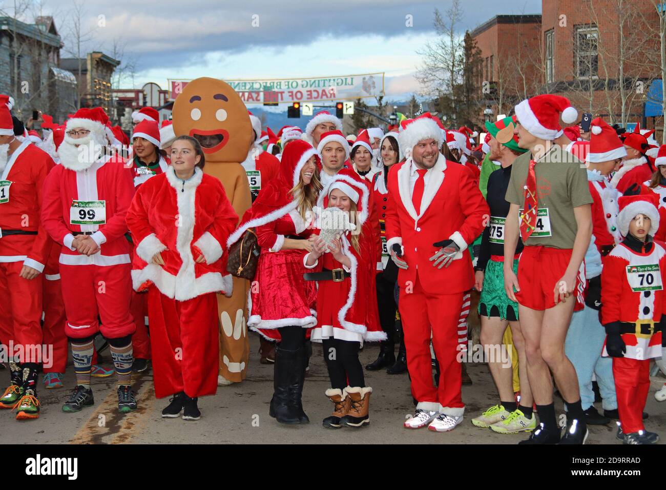 People dressed in santa suits and one gingerbread man in annual race for charity Stock Photo