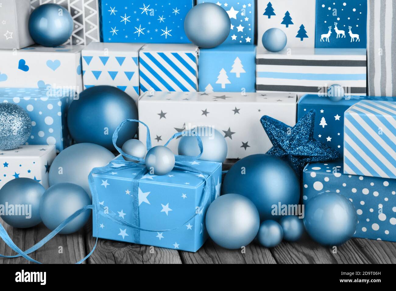 Blue Christmas gifts and ornaments on wooden background Stock Photo