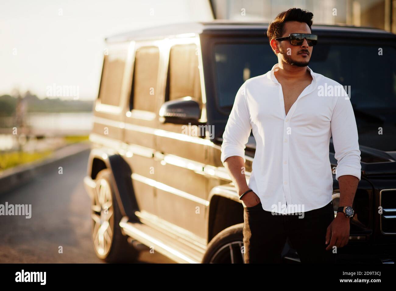 Solid asian man in white shirt and sunglasses posed near black mafia suv  car Stock Photo - Alamy