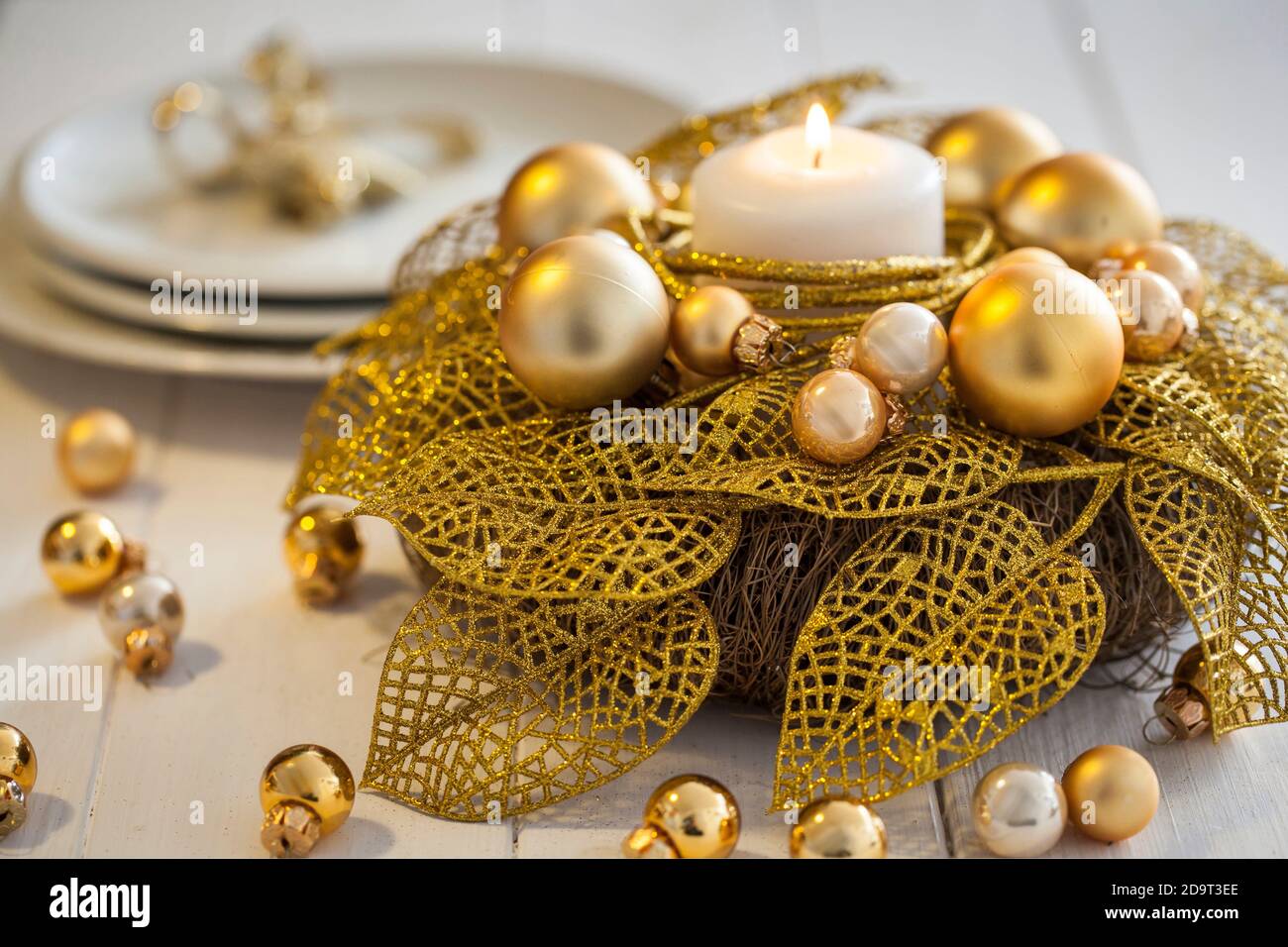 A gold Christmas table decoration AVAILABLE UK USE ONLY - PLEASE CALL ...