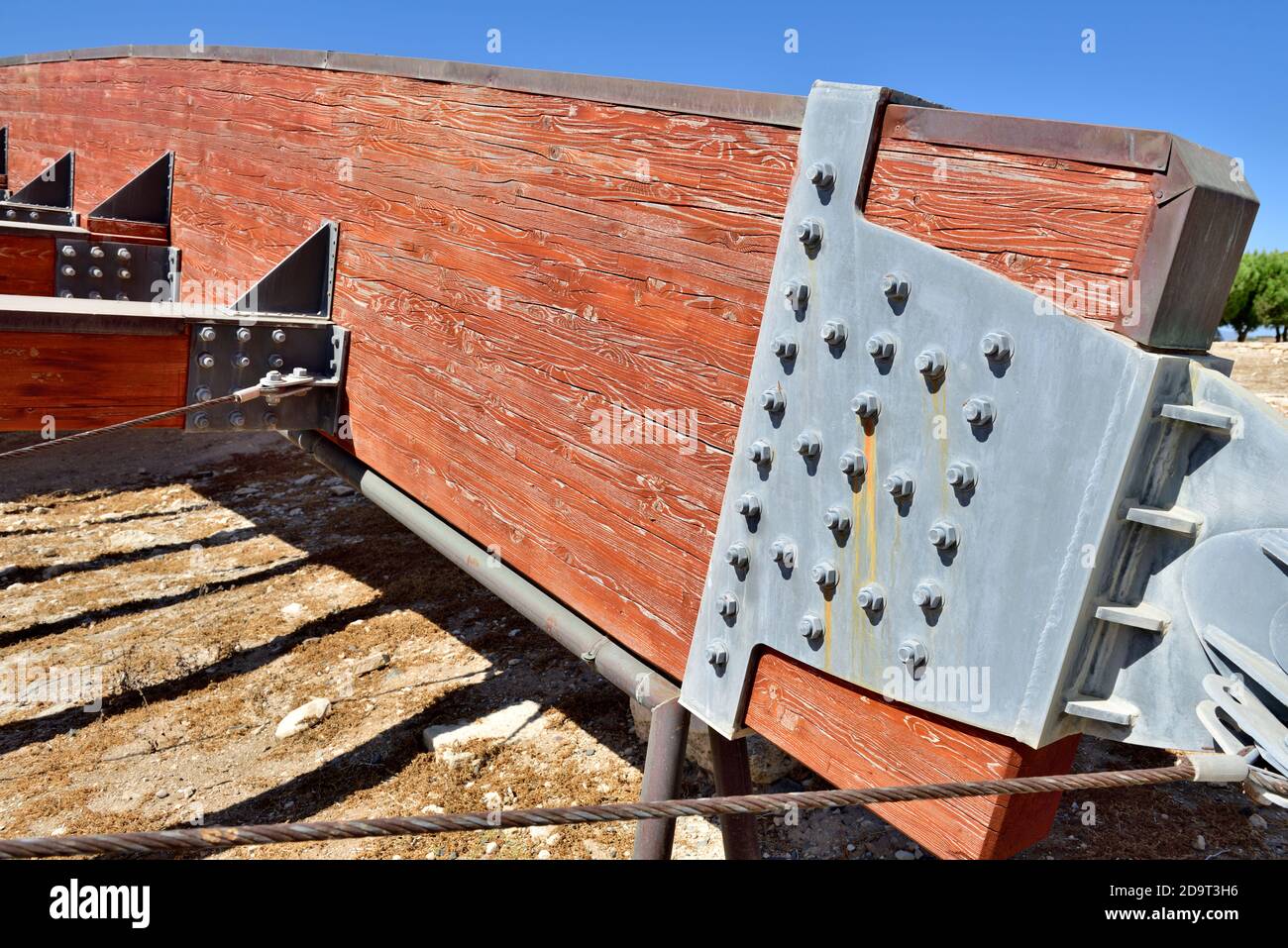 Heavy laminated structural timber beam with bolted hardware joints in roof covering site of “House of Eustolios”, Kourion Archaeological Site, Cyprus Stock Photo