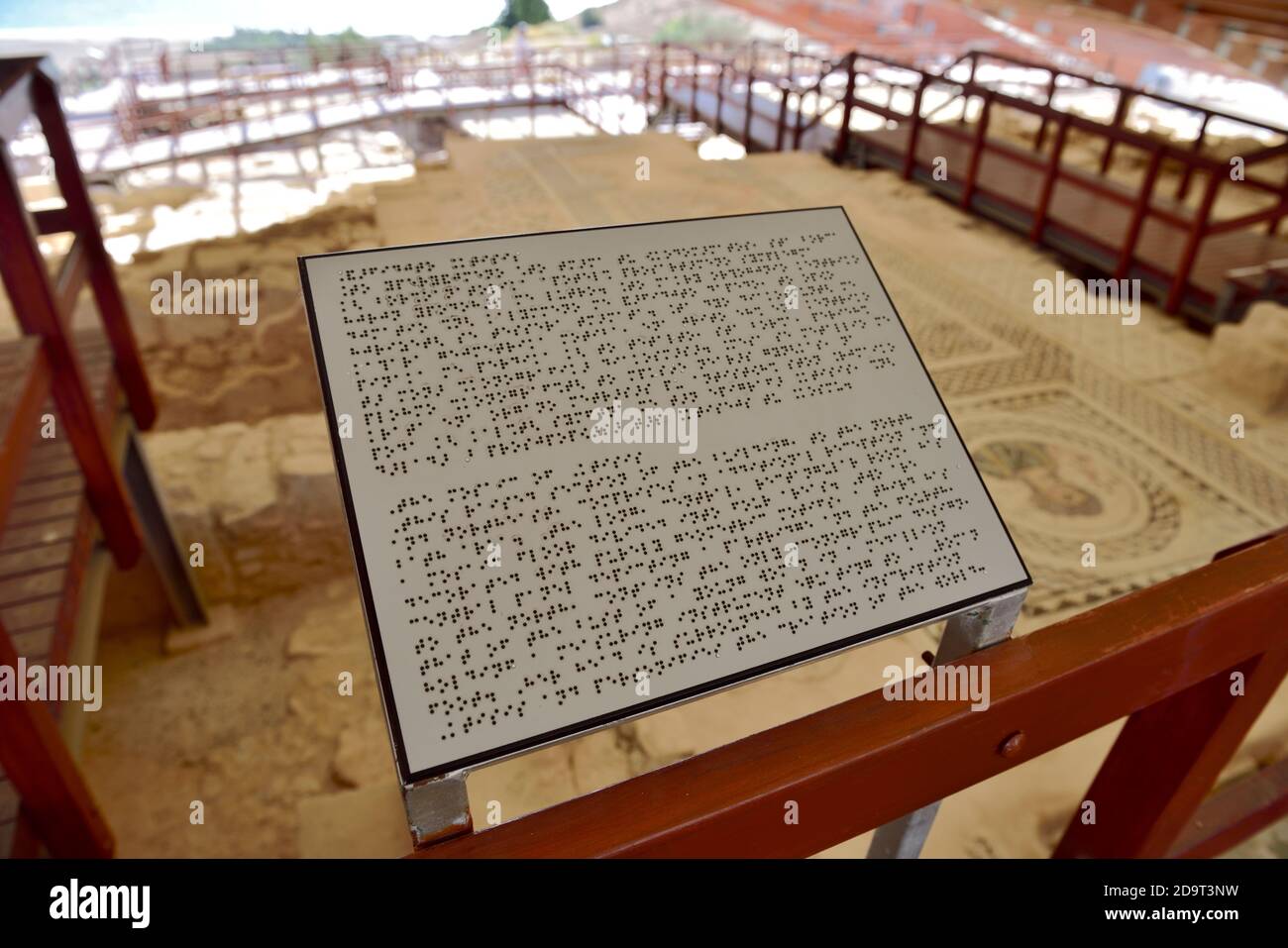 Information sign written in Braille for blind or partially sighted at “House of Eustolios”, Kourion Archaeological Site, Cyprus Stock Photo