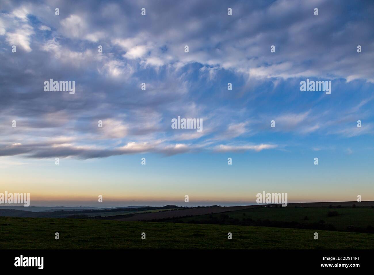 Clouds just after sunrise, on Firle Beacon in Sussex Stock Photo