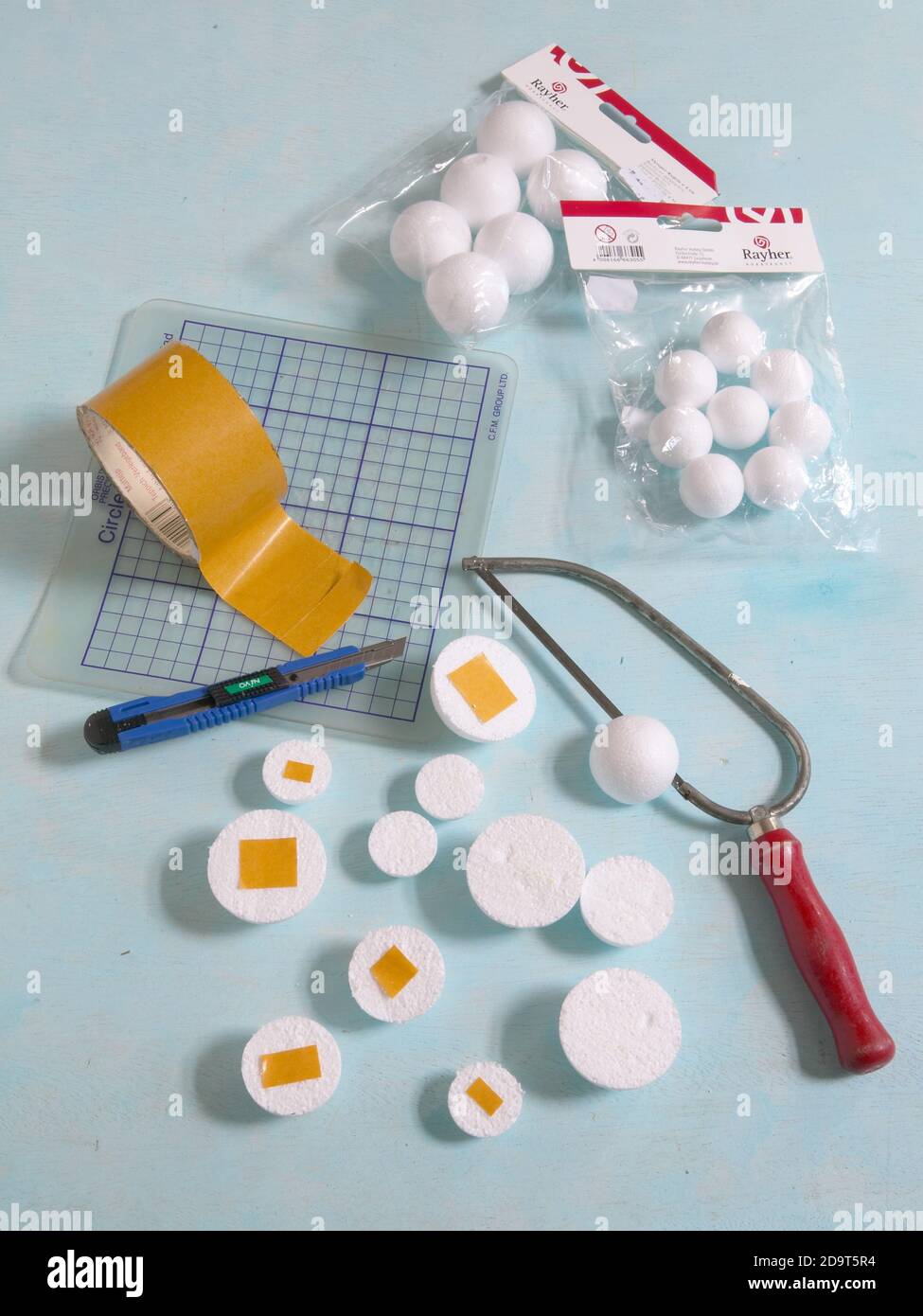 Split styrofoam balls and adhere tape    UK USE ONLY/EMAIL TO CLEAR OTHER RIGHTS Stock Photo