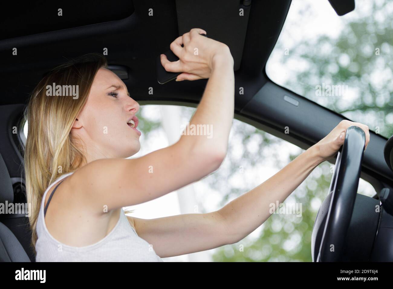 angry woman driver with road rage yelling at someone Stock Photo - Alamy