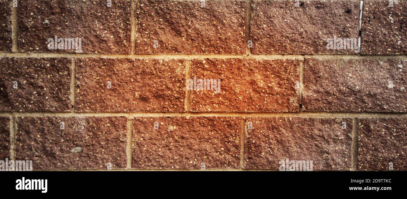 Old red gringe brick wall in a background image Stock Photo