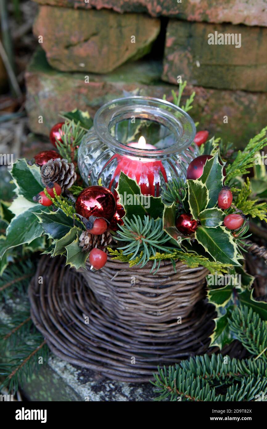 Glass candle holder with red candle and Christmas foliage AVAILABLE UK