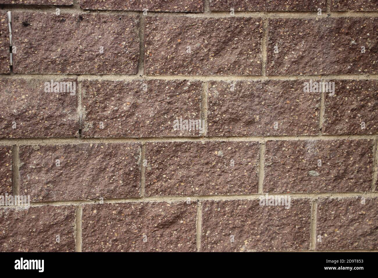 Old red gringe brick wall in a background image Stock Photo