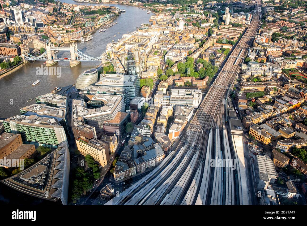 aerial sunset view of London Bridge train station overlooking Thames river and Bridge Tower in London Stock Photo