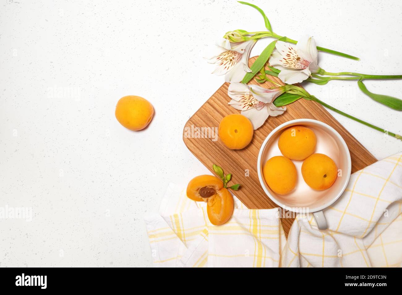 Apricot composition with wooden desk, white Stock Photo