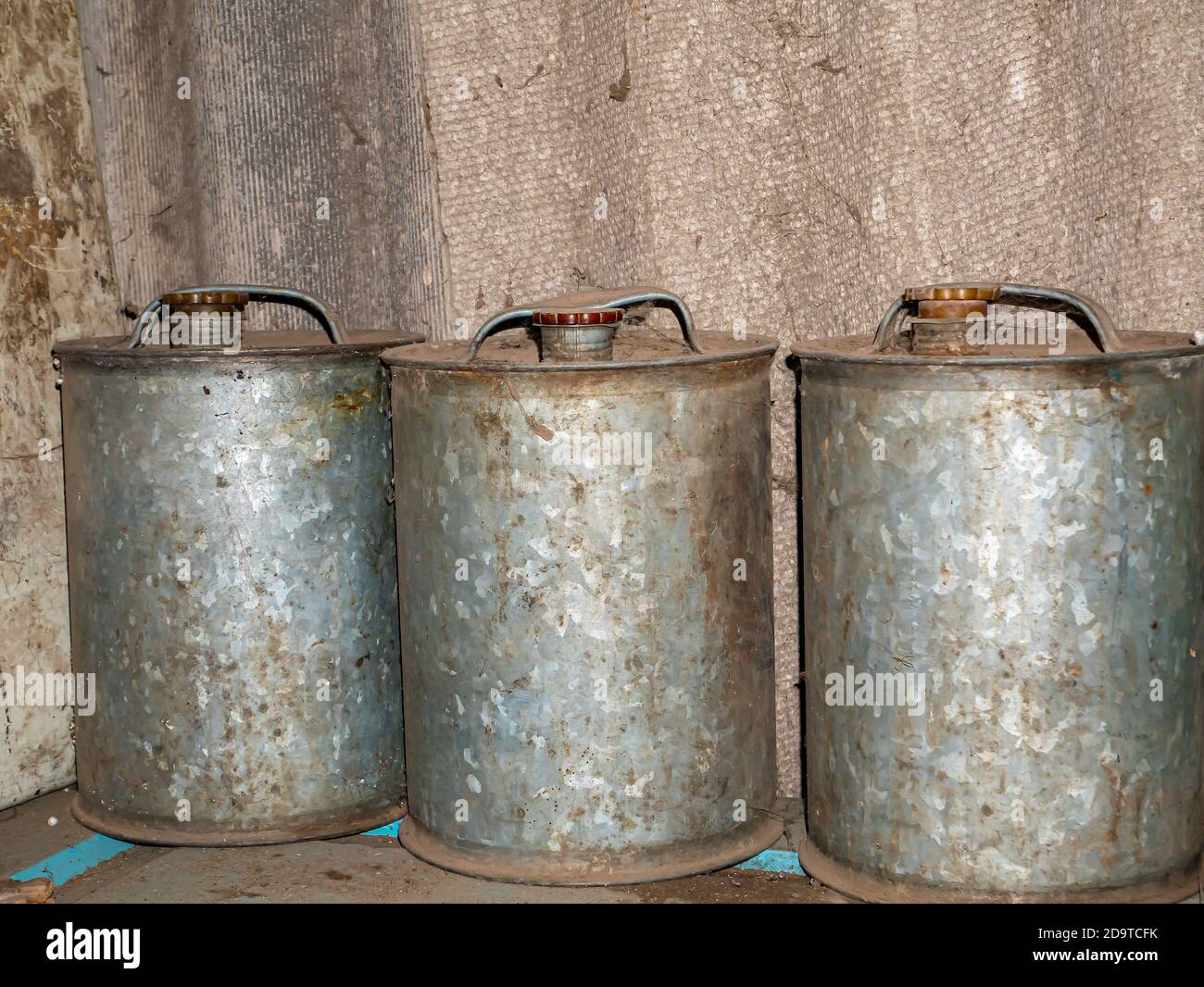Old stainless steel canisters for storing fuels and lubricants Stock