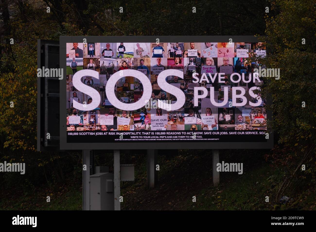 SOS Save Our Pubs digital billboard campaign to spell out the impact of restrictions on Scotland's hospitality industry, Glasgow, Scotland, UK Stock Photo