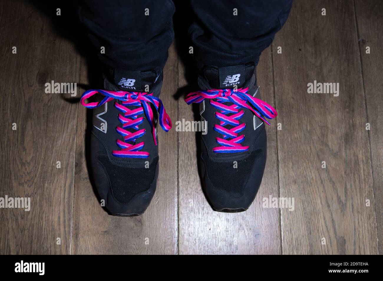 A pair of Black New Balance 500 Trainers with Stonewall's Bisexual Rainbow  Laces Stock Photo - Alamy