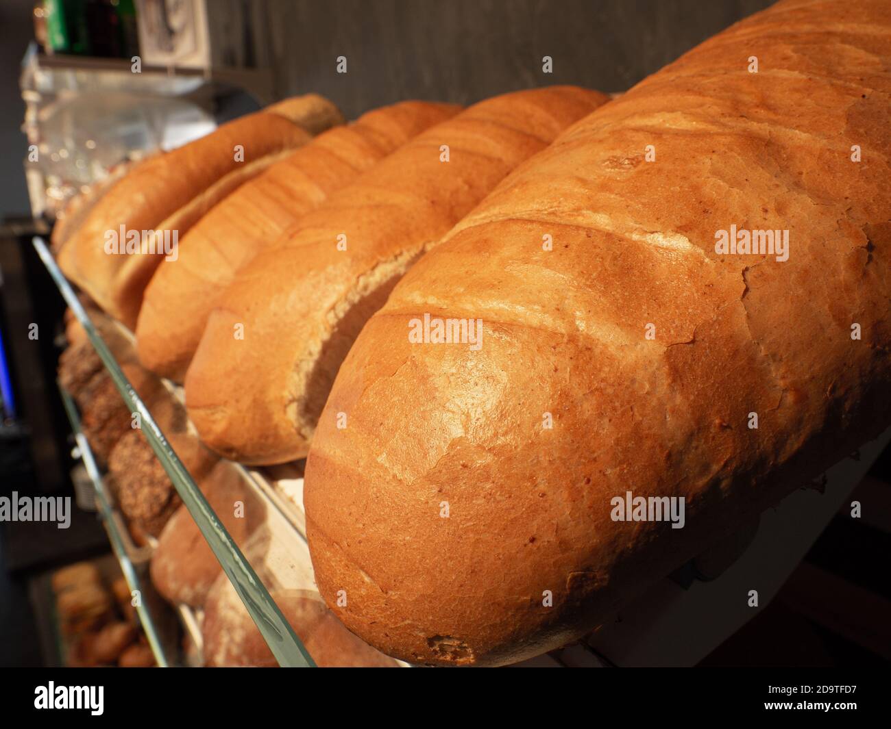 in the display of a bakery there is a wide variety of baked goods to