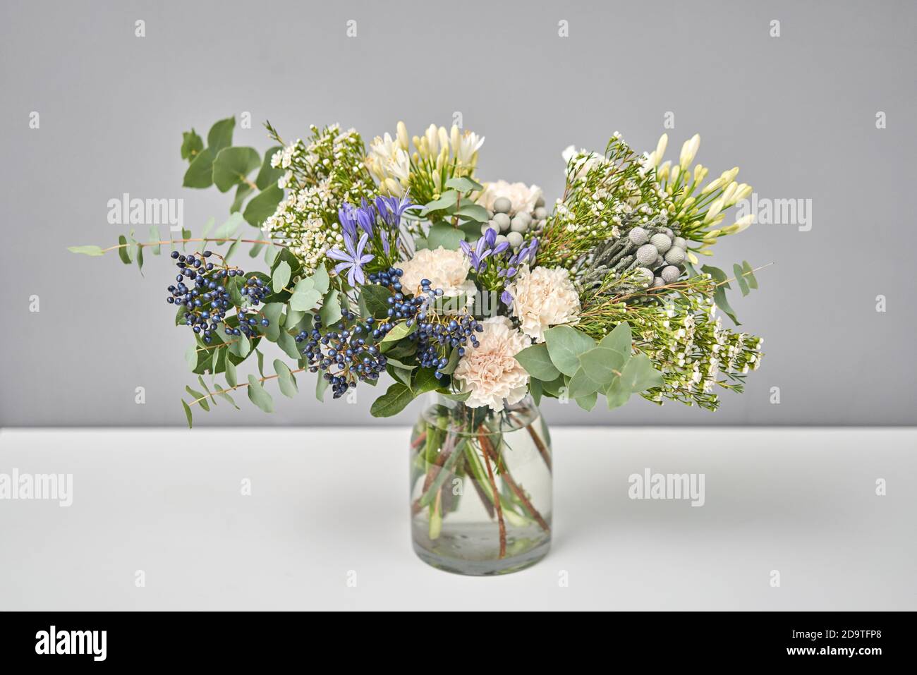 Bouquet 009. Finished flower arrangement in a vase for home. Flowers bunch, set for interior. Fresh cut flowers for decoration home. European floral Stock Photo