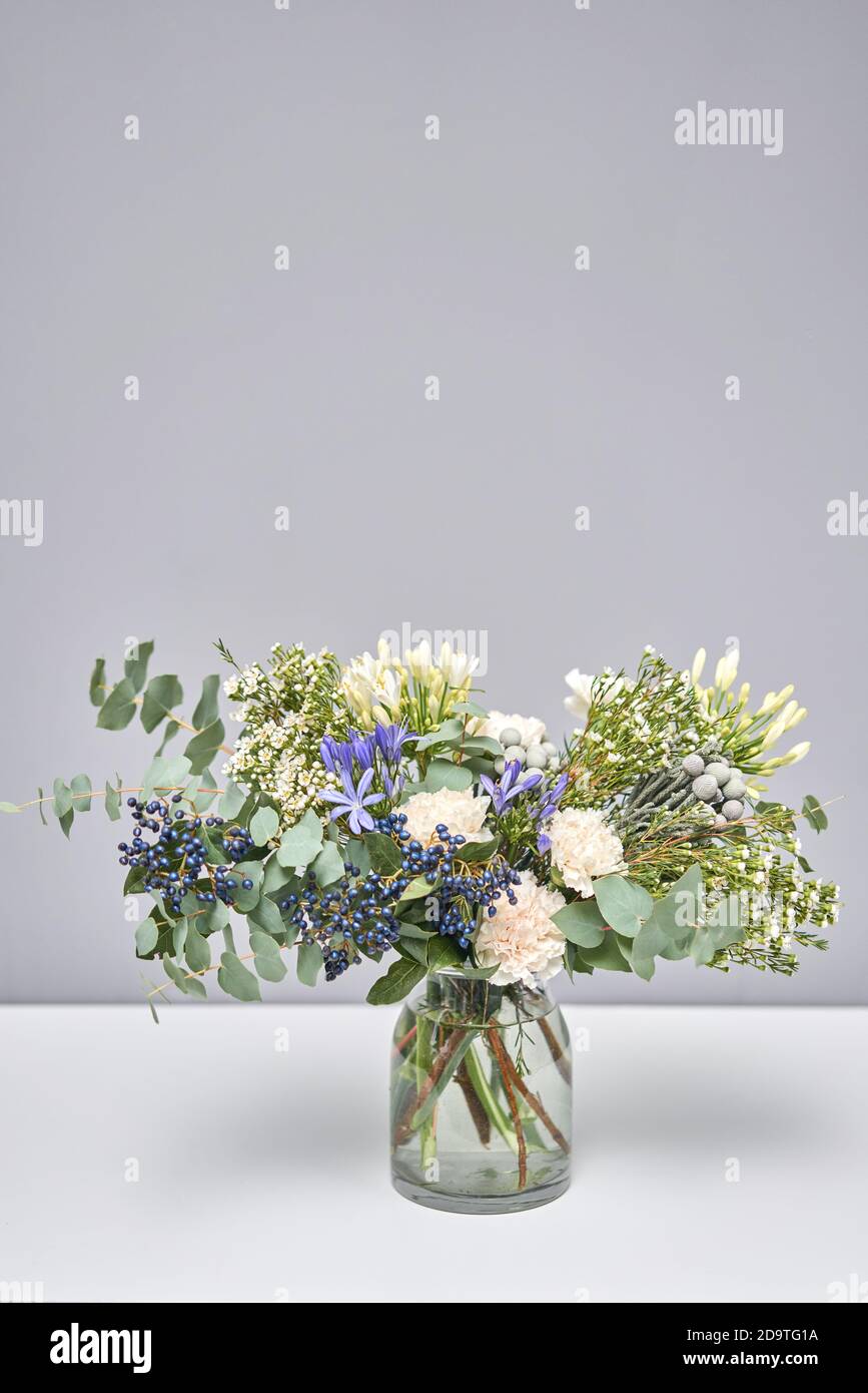 Bouquet 009. Finished flower arrangement in a vase for home. Flowers bunch, set for interior. Fresh cut flowers for decoration home. European floral Stock Photo