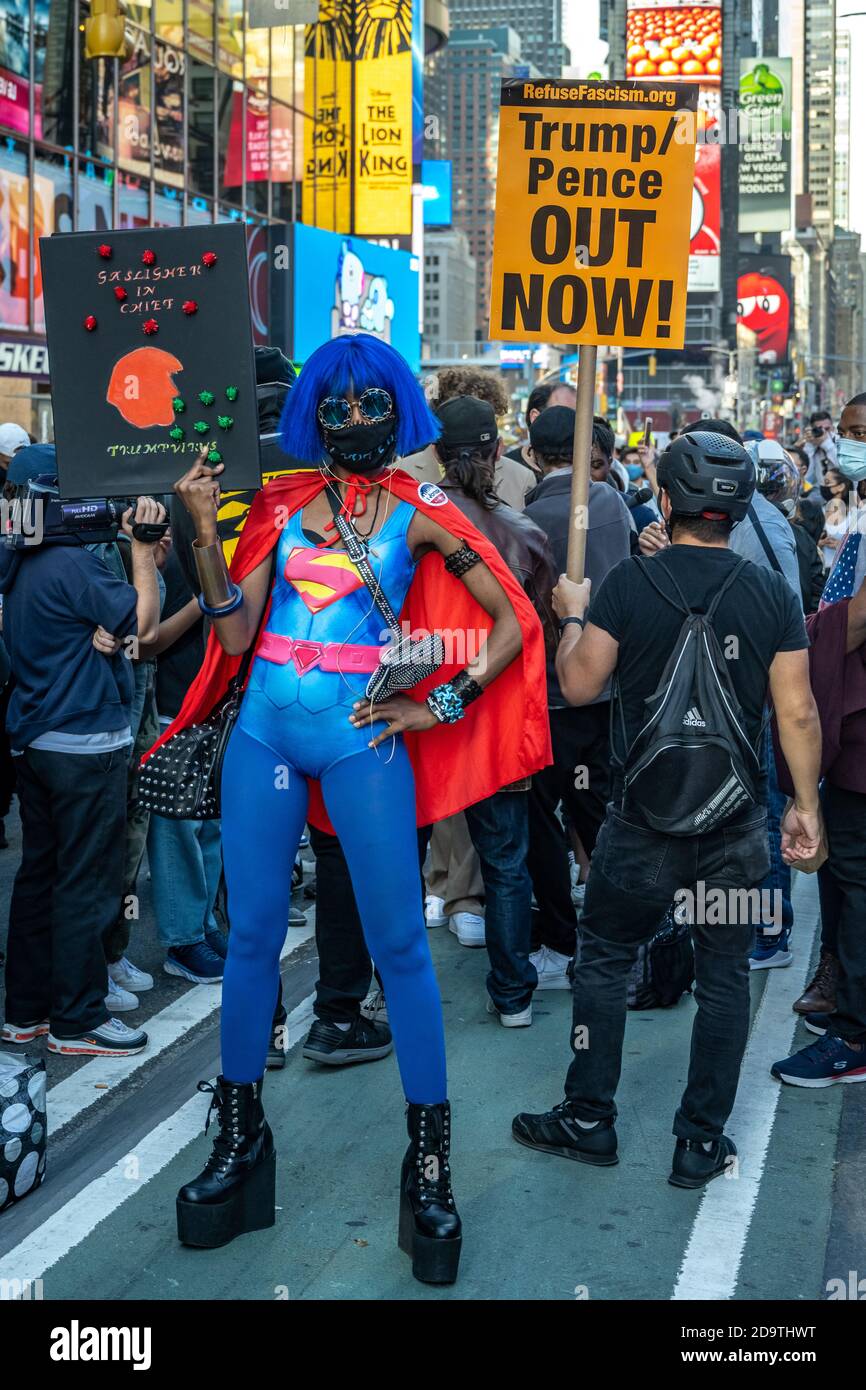 New York, USA. 7th Nov, 2020. People wear face masks as they celebrate in  New York City's Times Square after news broke out that former vice-president  Joe Biden won the US presidential