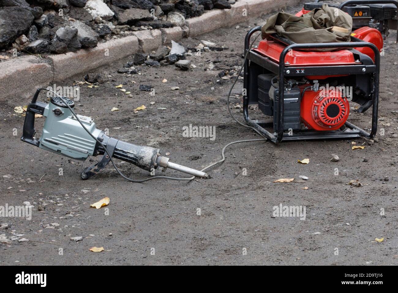 Electric jackhammer with a gasoline generator ready to work against the