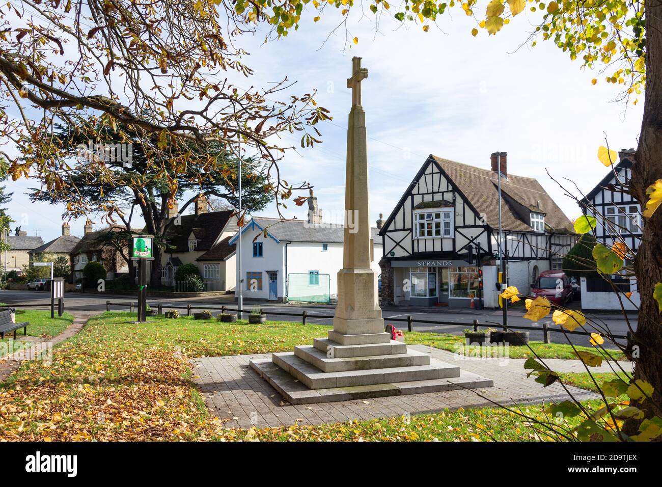 Village sign and war memorial, High Street, Melbourn, Cambridgeshire, England, United Kingdom Stock Photo
