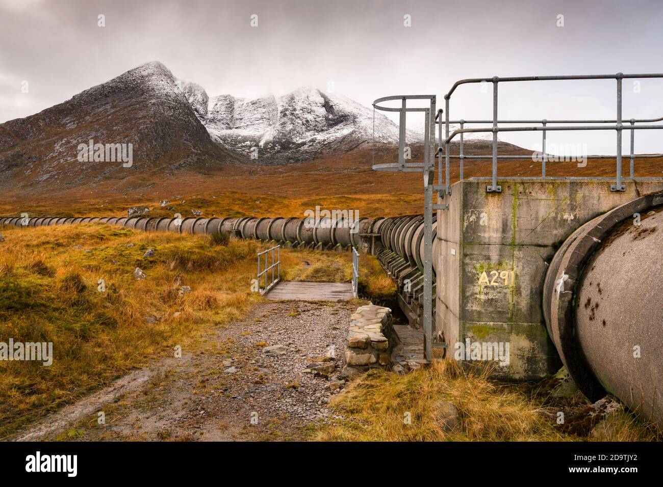 Original concrete pipe / aqueduct taking water into Loch Fannich, Highland Scotland, as part of the hydro-electric scheme in that area. Stock Photo