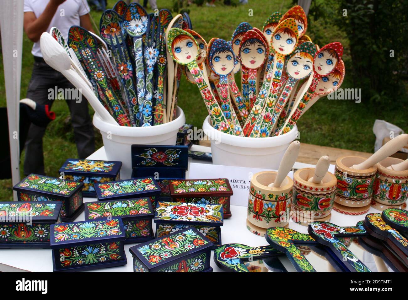 Hand-carved, hand-painted traditional wooden crafts for sell at a country fair in Brasov County, Romania Stock Photo