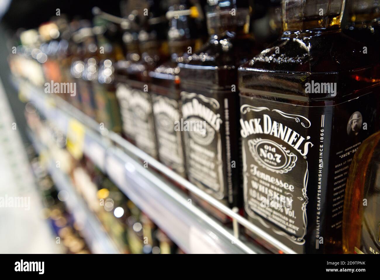 Row of Jack Daniels Whiskey bottles on a supermarket shelf Stock Photo