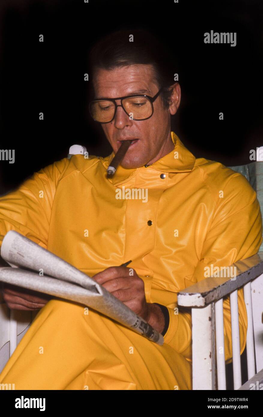 Roger Moore at the Pinewood Studios in England on a break from shooting a James Bond film Stock Photo