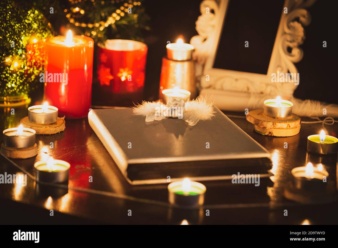 Pictures of candles and books for ritual, mysticism and mysteries about superstition. Concept Divine magic & occultism Stock Photo