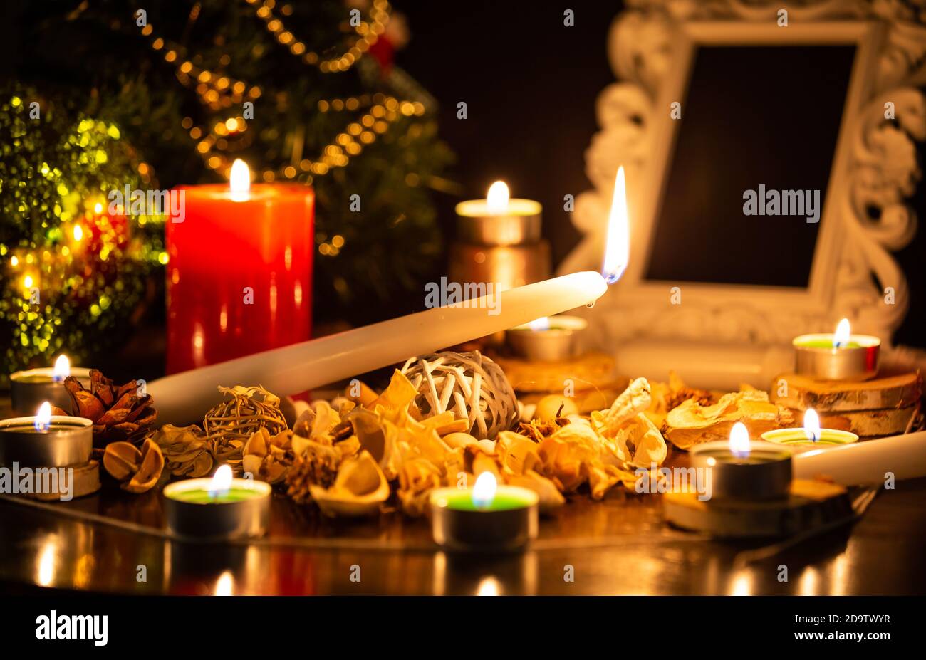 Images of candles and sacred wood to perform magic rituals and mysteries about superstition. Concept Divine magic & occultism on the old wooden table. Stock Photo