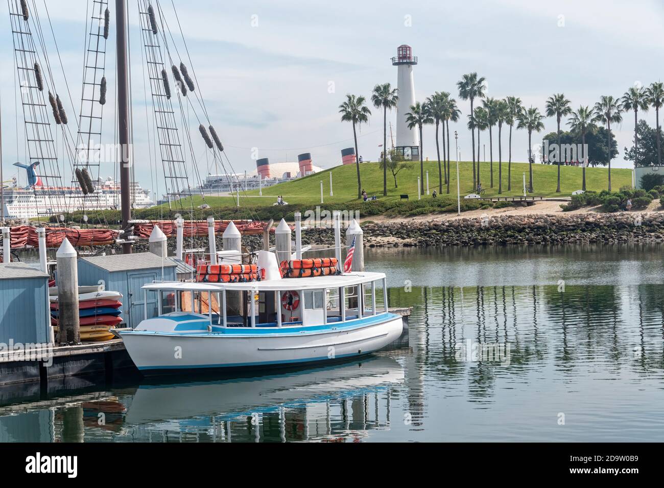 Long Beach, California, USA - March 10, 2017: City of Long Beach, Rainbow Harbor with boats and lighthouse. Stock Photo
