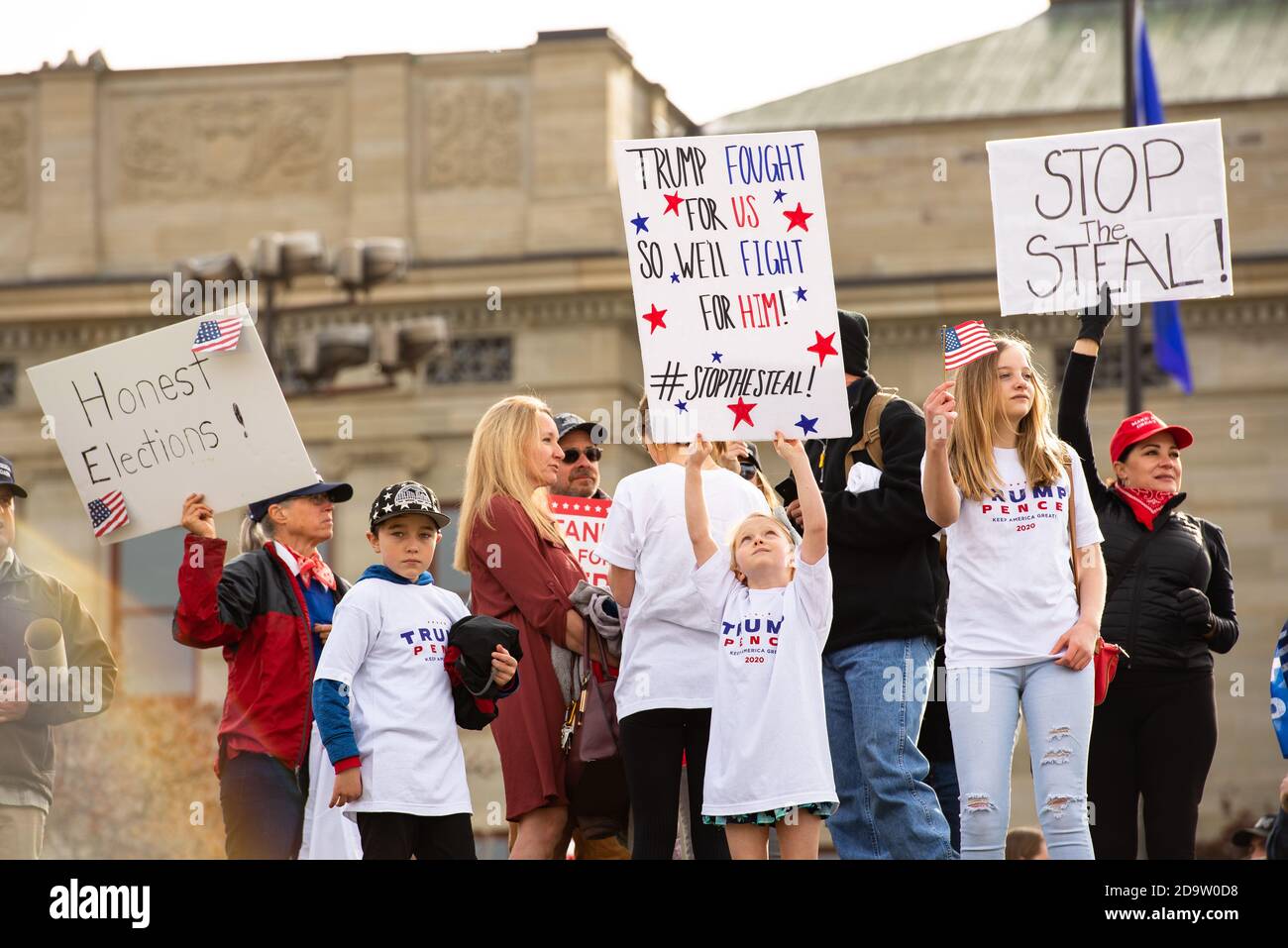 Helena, Montana / Nov 7, 2020: Protesters at 'Stop the Steal' rally holding signs for honest election and in support of Donald Trump, little girl hold Stock Photo