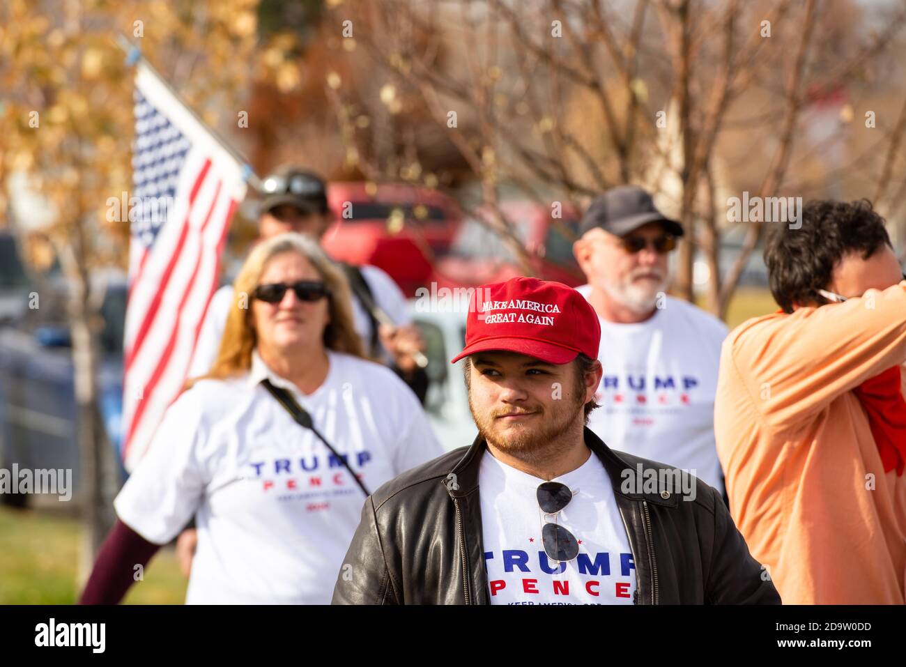 Helena, Montana / Nov 7, 2020: Pro-Trump supporter protesting at #stopthesteal rally at the Capitol wearing Make America Great Again red hat against t Stock Photo