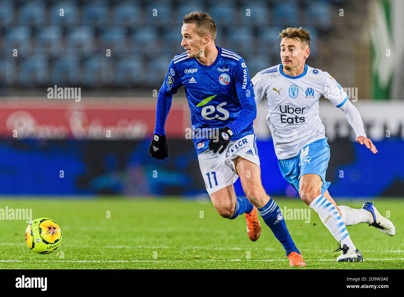 Dimitri Lienard of Racing Strasbourg (L) is chased by Valentin Rongier of  Olympique de Marseille (R) during the Ligue 1 match between RC Strasbourg  an Stock Photo - Alamy