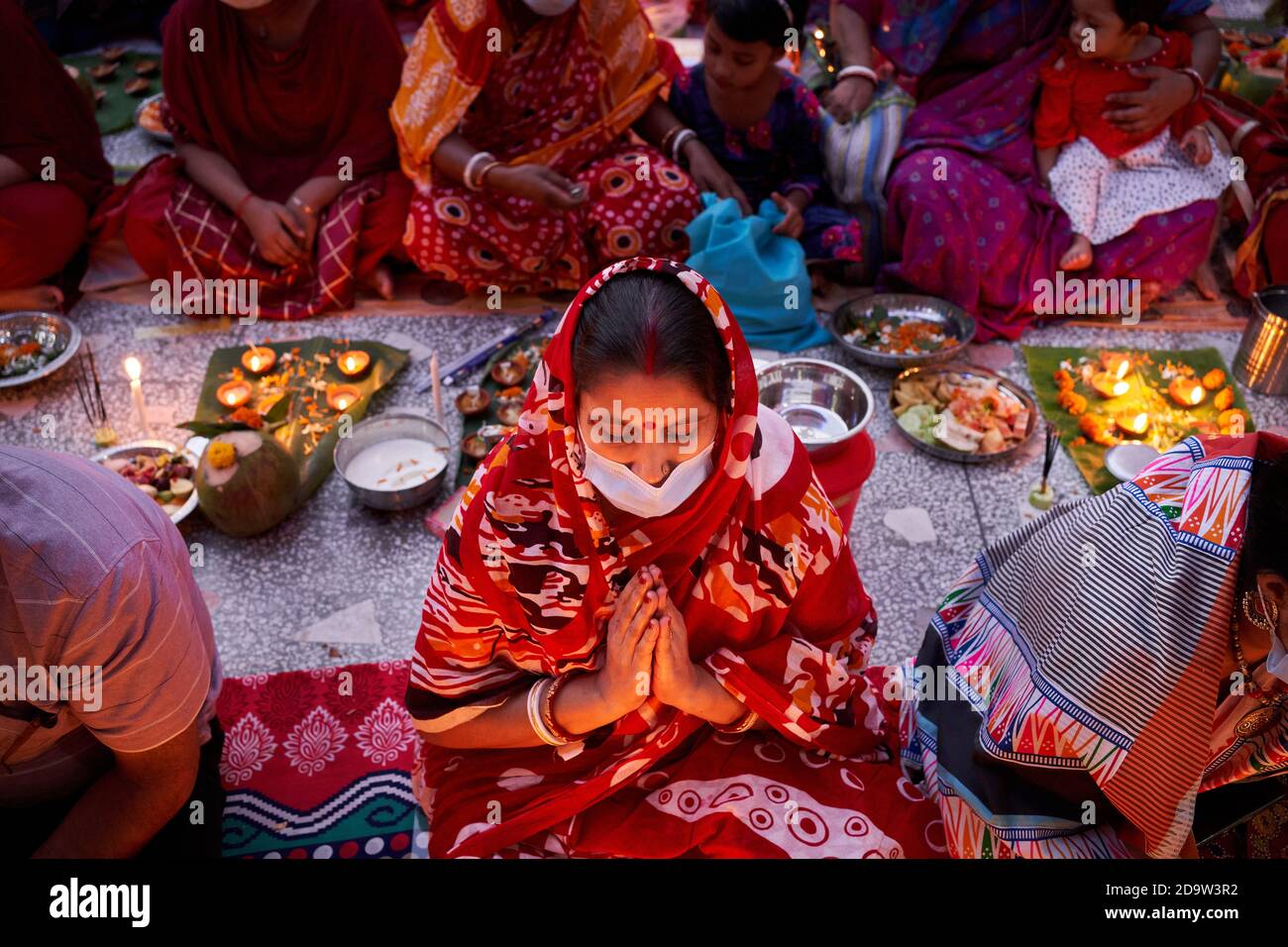 Thousands of Hindu devotees sit with Prodip and pray to God in front of  Shri Shri Lokanath Brahmachari Ashram temple during the religious festival  Kartik Brati or "Rakher Upobash" in Dhaka. (Photo