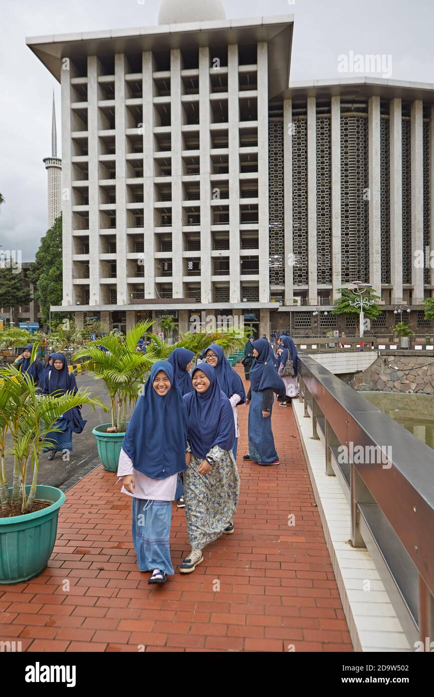 Jakarta, Indonesia March 2016.  Young Muslim women outside the Istiqlal mosque. Stock Photo