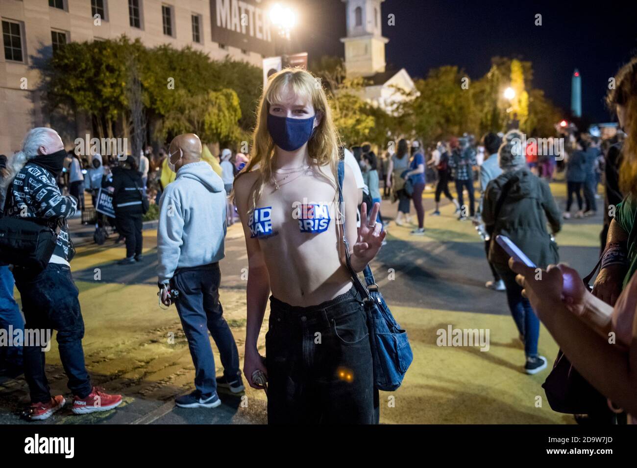 Lana Coulon, of Washington, DC, poses for photographers along Black Lives  Matter Plaza as people celebrate and dance in the streets near the White  House in the hours after Democratic presidential candidate