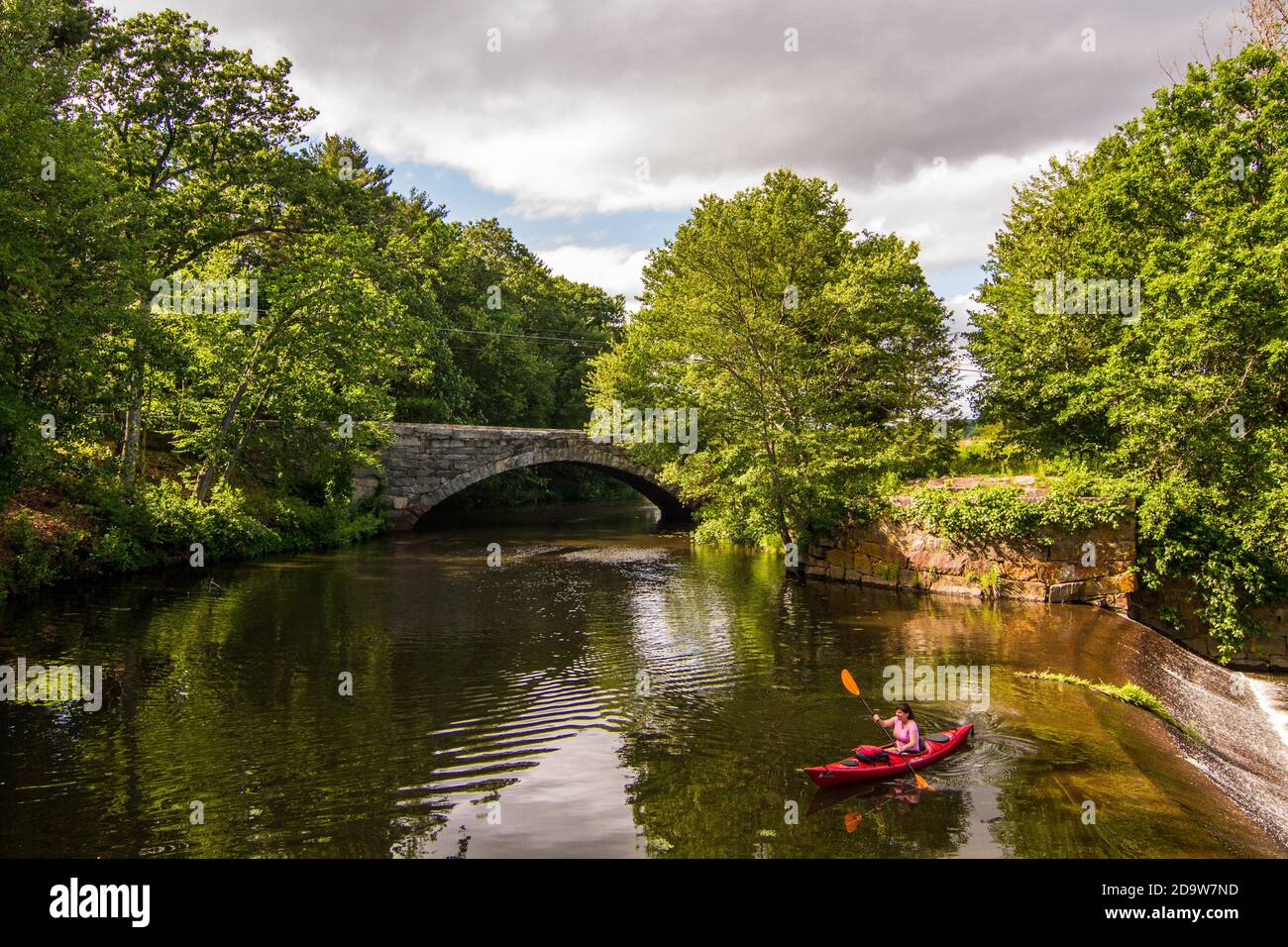 The Blackstone River and the old stone arch bridge in Uxbridge, Massachusetts Stock Photo