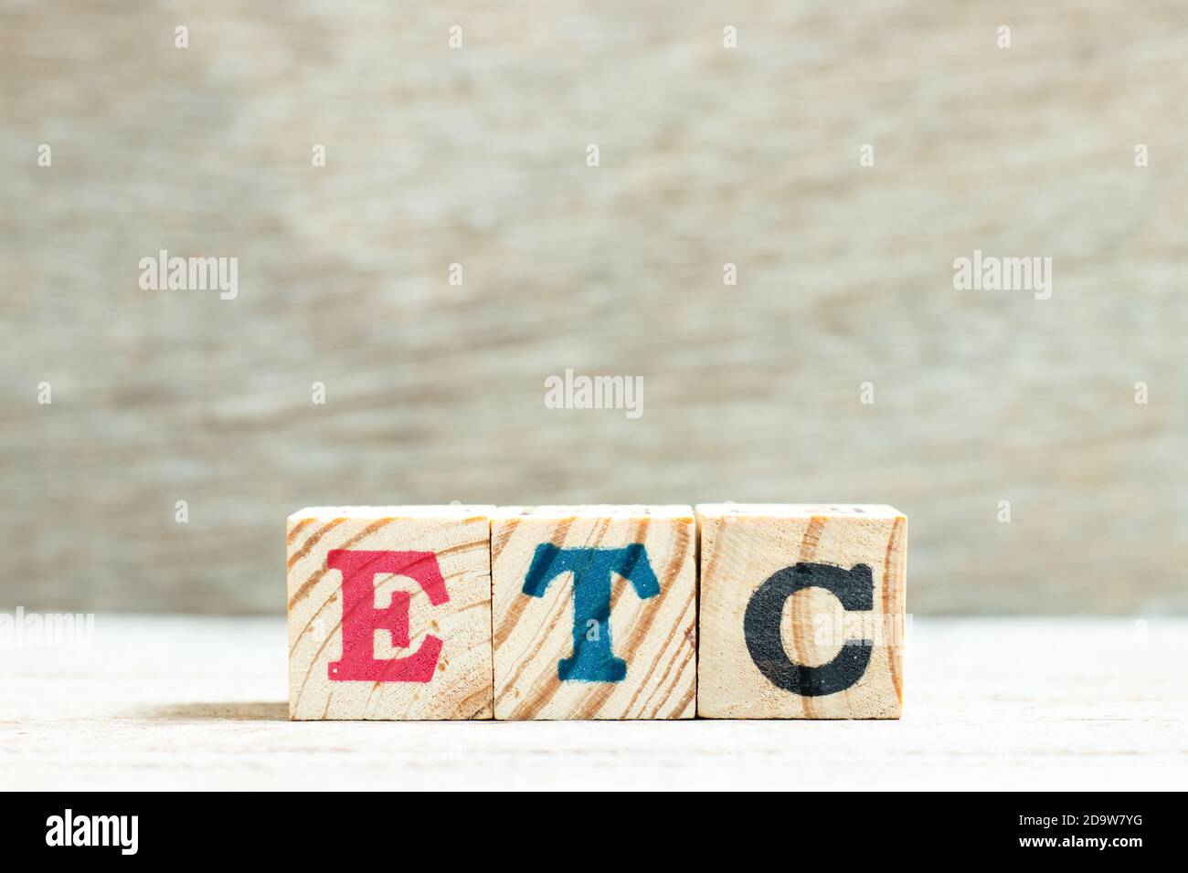 Alphabet letter in word etc (abbreviation of et cetera) on wood background Stock Photo Alamy