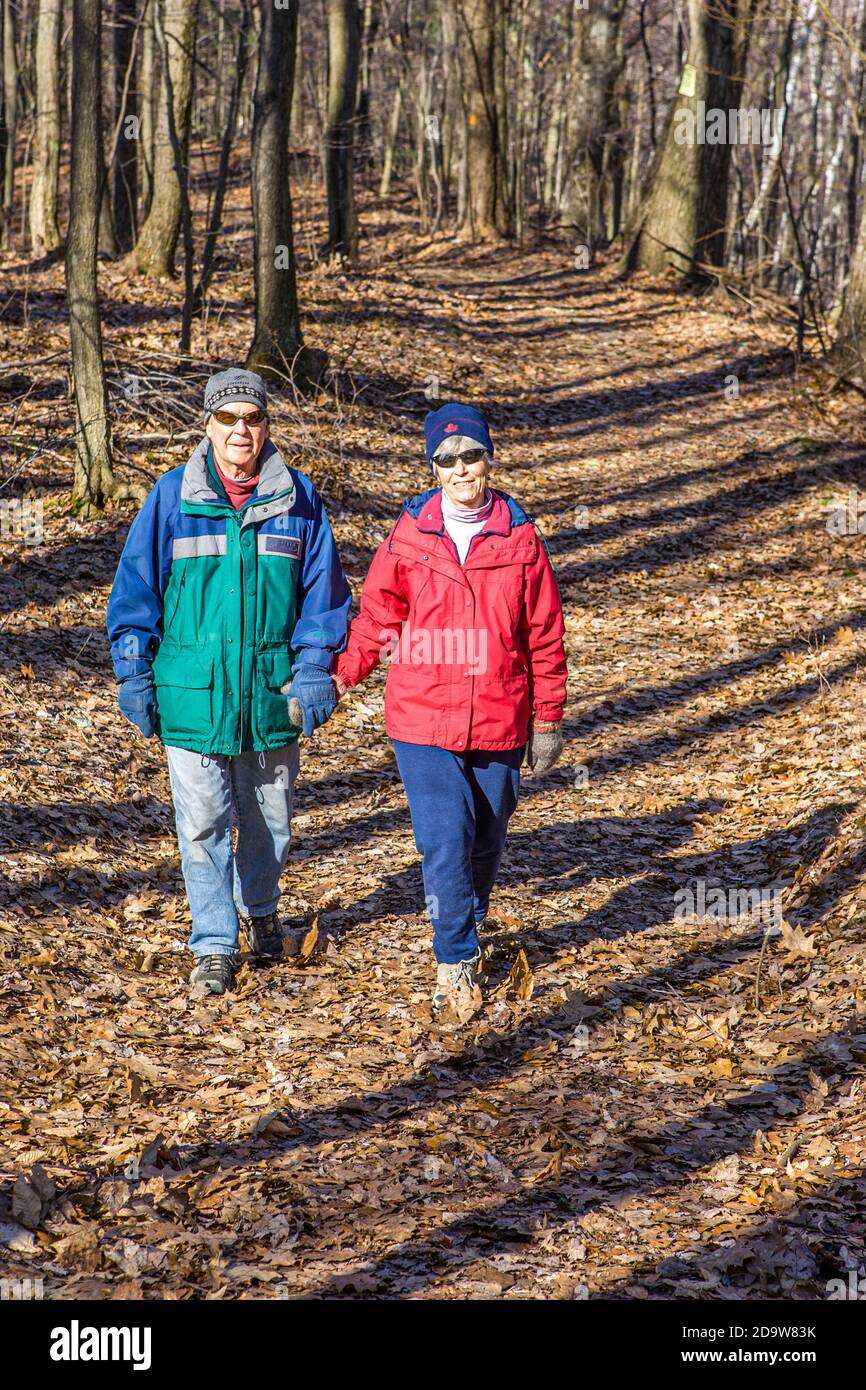 Older woman walking along forest hi-res stock photography and images ...