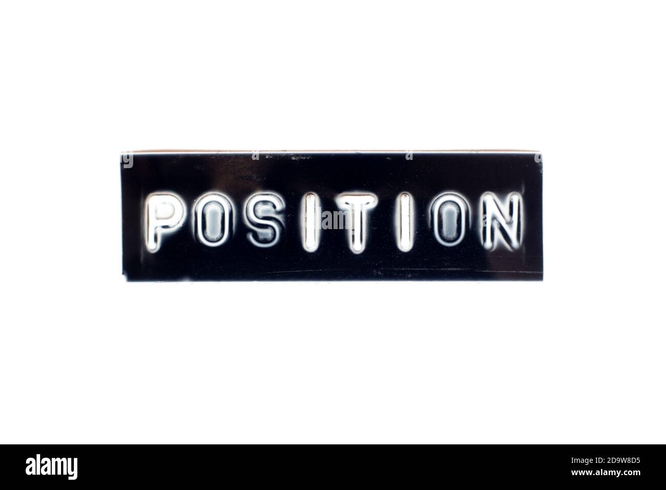 Embossed letter in word position in black banner on white background