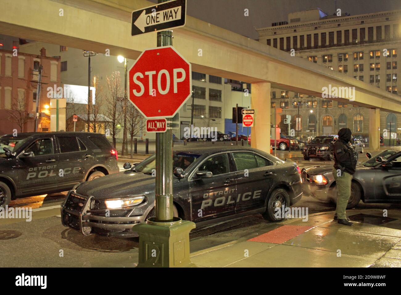 Detroit police officers downtown on a rainy night in Detroit, Michigan, USA Stock Photo
