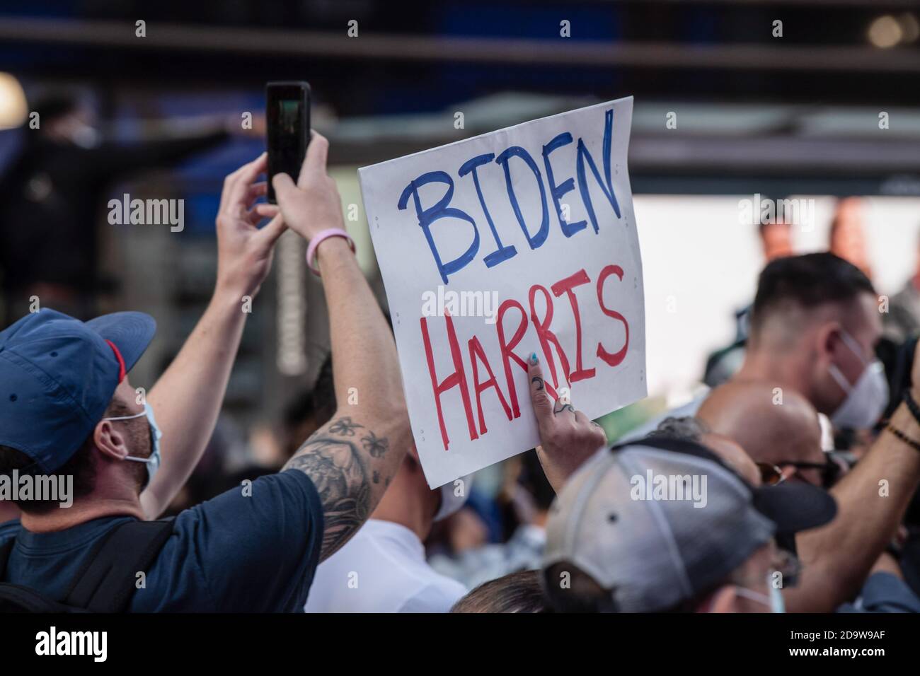 New York, United States. 07th Nov, 2020. A supporters with a placard celebrates Biden/Harris ticket election victory in Times Square. People have taken to the streets in droves after several major media outlets called the election for former Vice President Joe Biden. NYPD report there is a range of 500 to 900 people gathered in Times Square. Similar groups gathered in the streets around the city and across the country. Credit: SOPA Images Limited/Alamy Live News Stock Photo