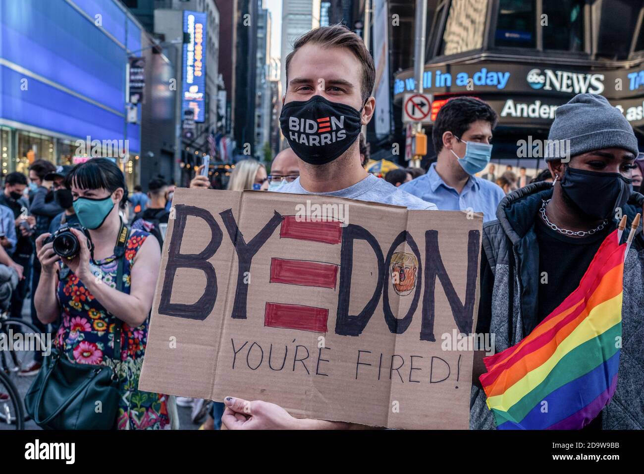 New York, United States. 07th Nov, 2020. A supporters with a placard celebrates Biden/Harris ticket election victory in Times Square. People have taken to the streets in droves after several major media outlets called the election for former Vice President Joe Biden. NYPD report there is a range of 500 to 900 people gathered in Times Square. Similar groups gathered in the streets around the city and across the country. Credit: SOPA Images Limited/Alamy Live News Stock Photo