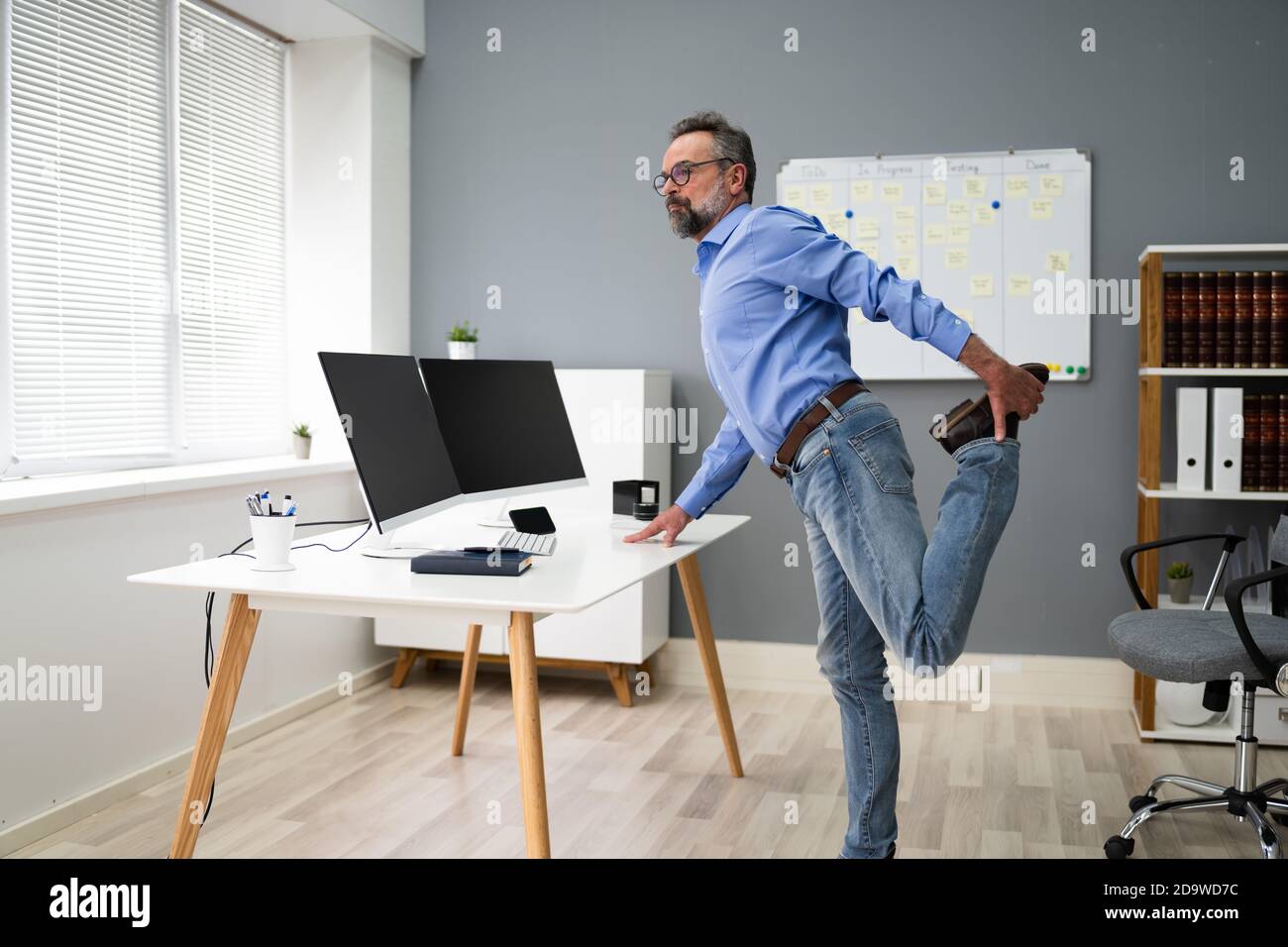 Yoga Office Workout And Gymnastics At Computer Business Desk Stock