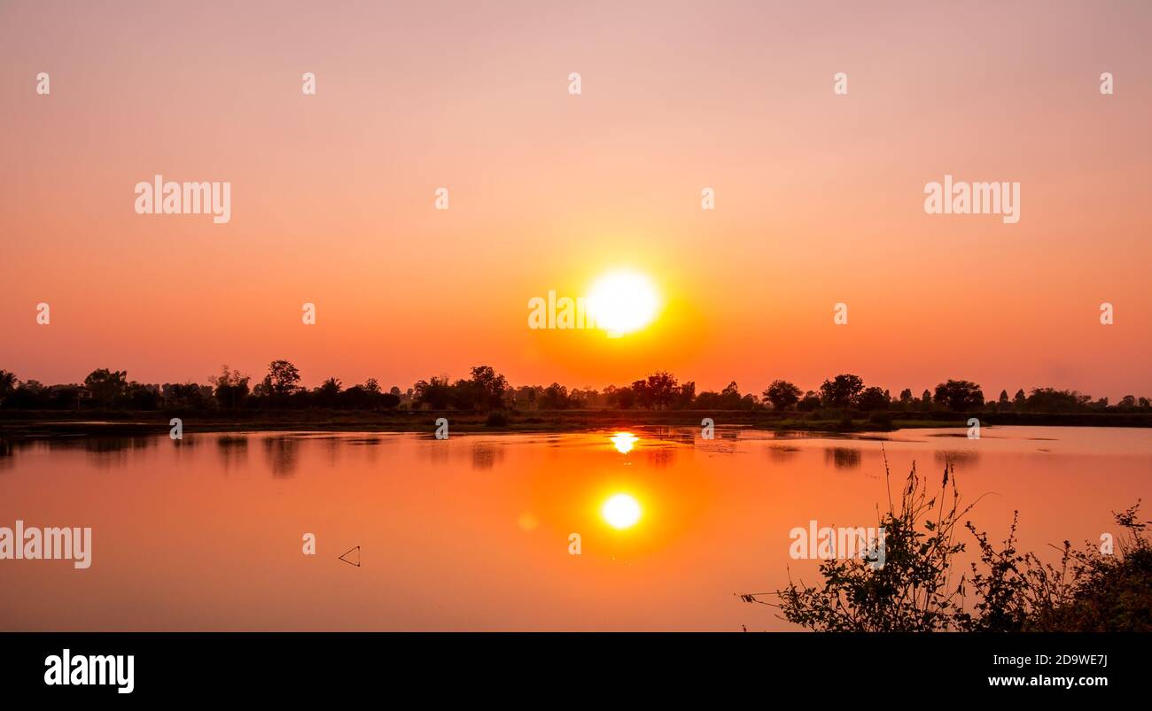 Beautiful landscape sunset at the river in the evening. Stock Photo